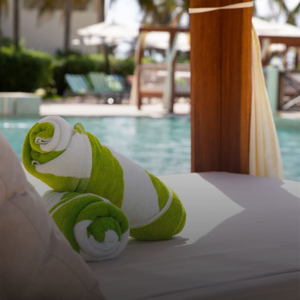Lavish in poolside privacy in one of 3 luxury cabanas